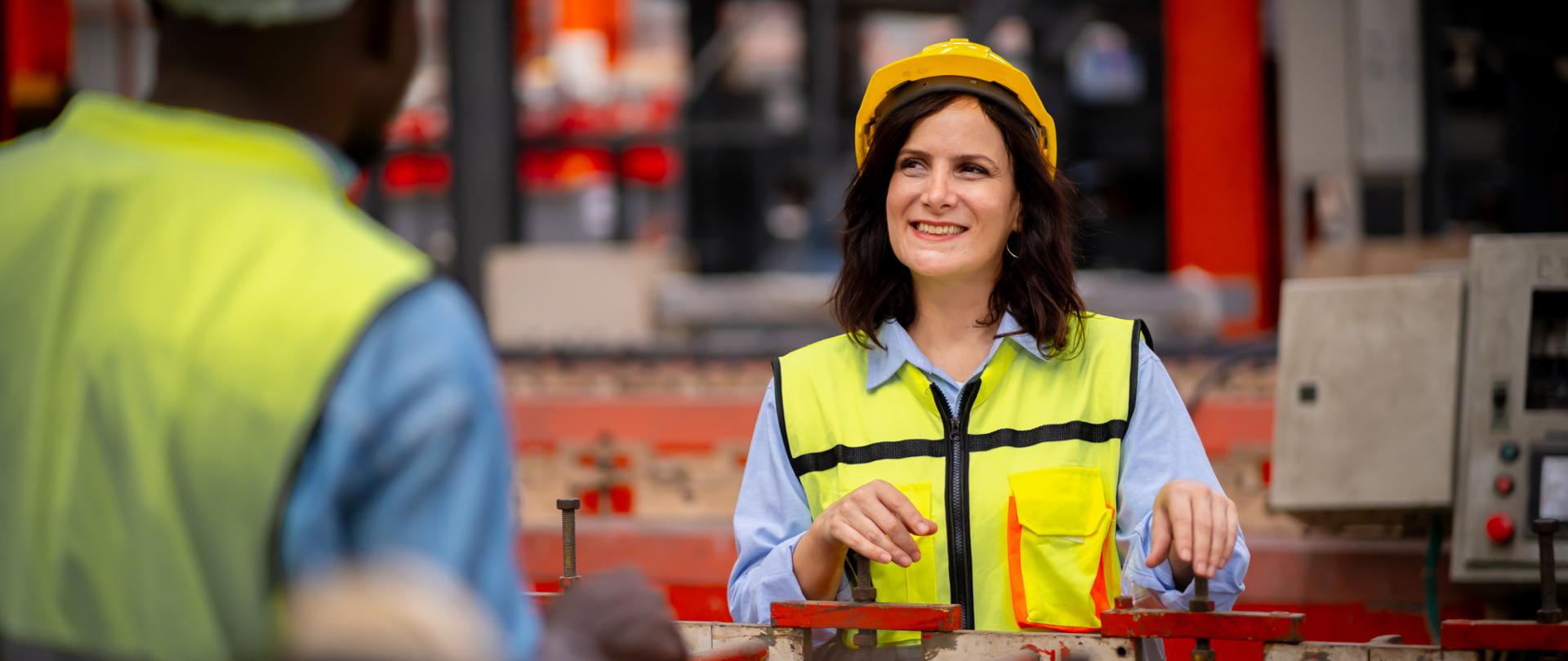 Young female engineer in metal sheet factory Responsible work is being inspected at the actual work site. Work professionally and happily