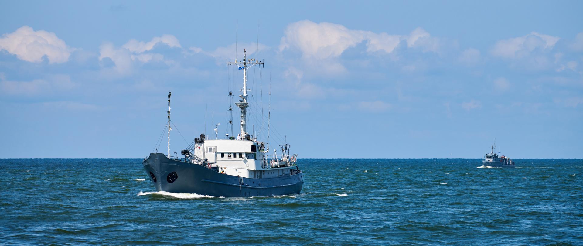Survey vessel, research vessel patrol boat sailing in bright blue Baltic Sea, navy patrol vessel. Military ship, warship, battleship of Baltic Fleet, Russian Navy