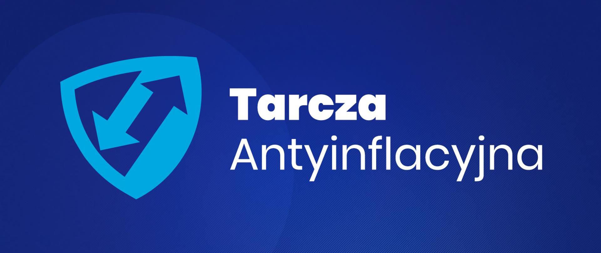 Po lewej stronie tarcza z dwoma strzałkami. Po prawej biały napis na niebieskim tle Tarcza Antyinflacyjna.