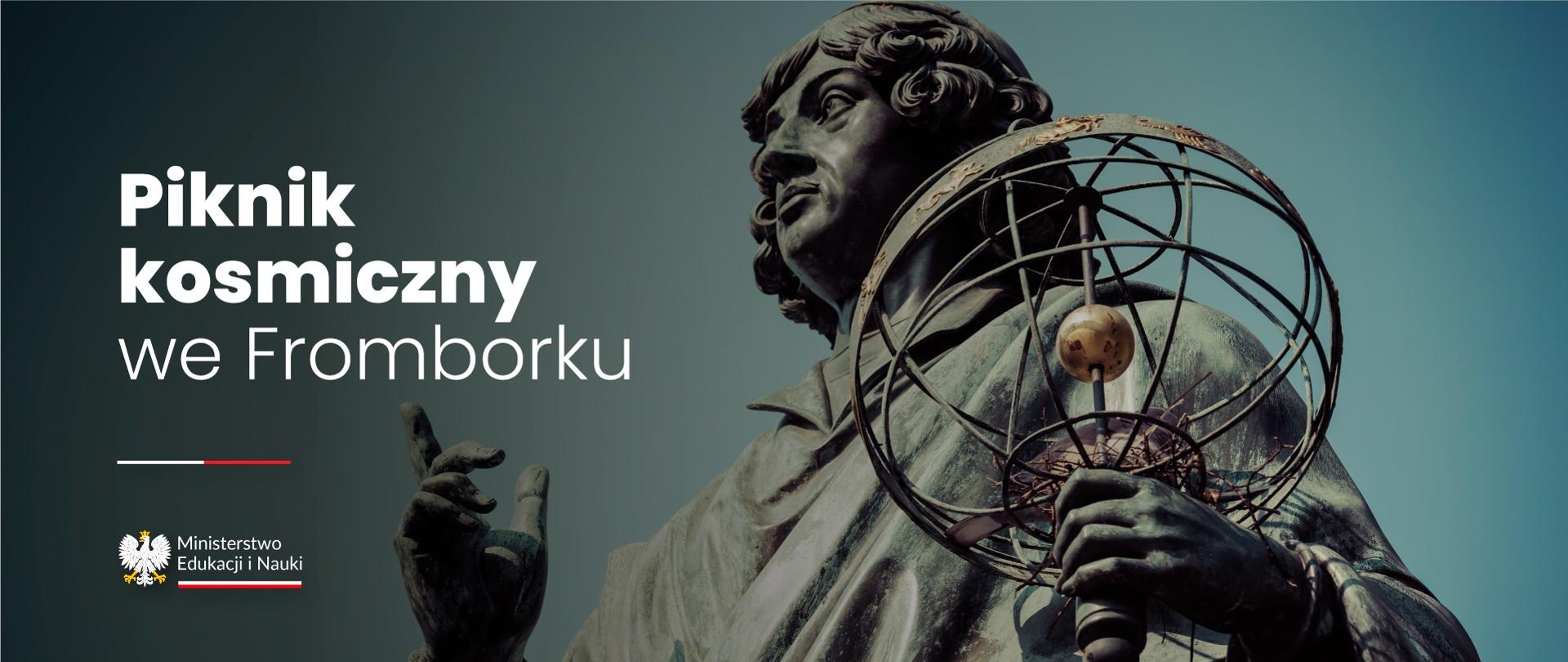 Zdjęcie pomnika Kopernika, obok napis Piknik kosmiczny we Fromborku.