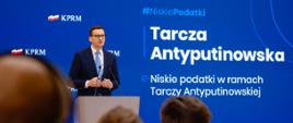 Premier podczas konferencji prasowej.
